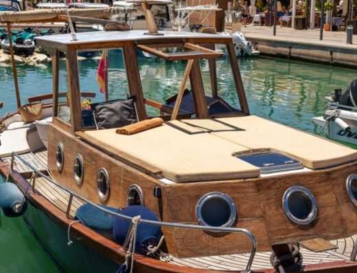 “Primera classic wooden boat available for rent, offering an authentic maritime experience.